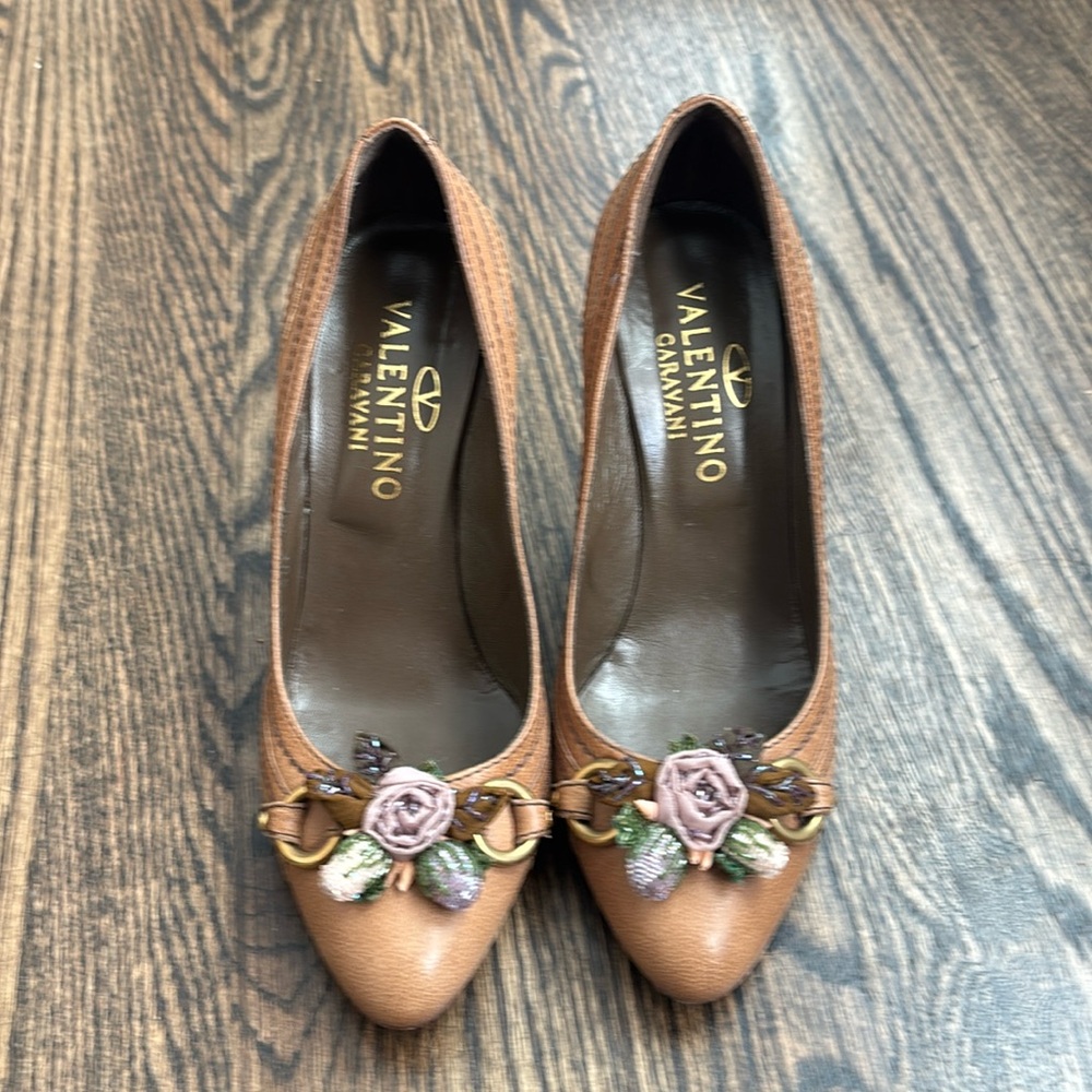 Valentino brown high heels with flower detail.